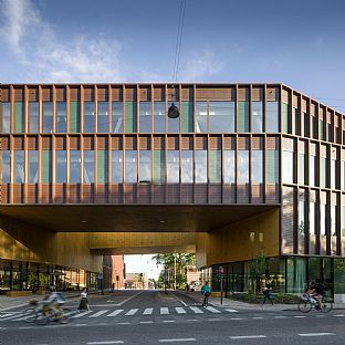 Carlsbergs Central Office consists of three wings, which unite in an atrium, the building’s central space. One of the wings forms a bridge over one of the neighbourhoods main access roads. - C.F. Møller Architects wins international recognition for sustainable building - C.F. Møller. Photo: Adam Mørk